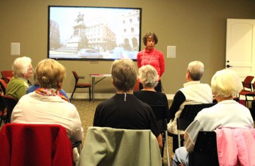 UBC Associate Professor Charlotte Jones talks with a group of Walk n’ Talk participants at the Heritage Retirement Residence. 
