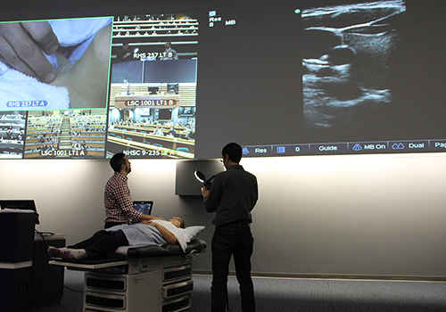 A portable ultrasound machine in use during an anatomy lecture presented at UBC Okanagan and video conferenced to medical students in Vancouver, Prince George and Victoria.