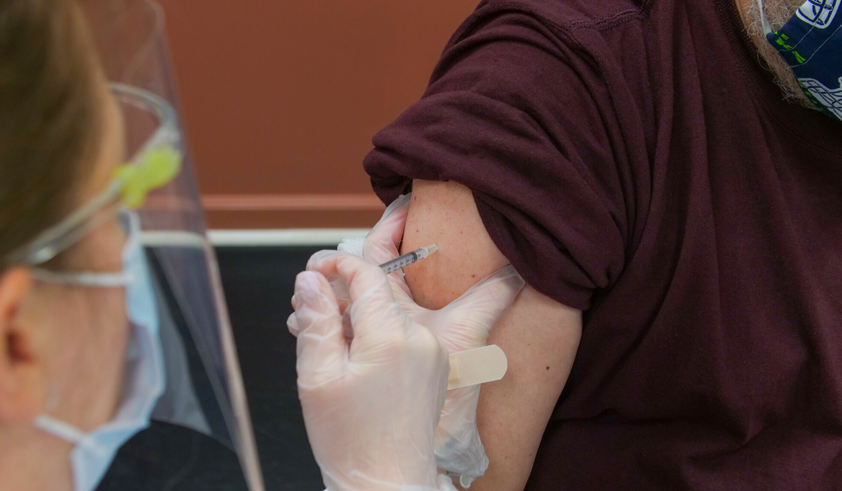 Man receiving COVID-19 vaccine