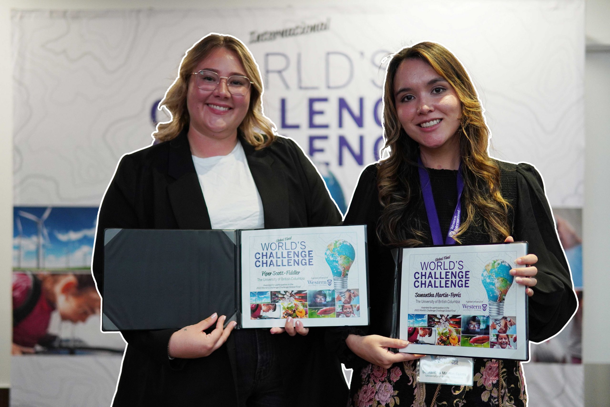 Piper Scott-Fiddler and Samantha Martin-Ferris holding their World's Challenge Challenge certificates. Photo courtesy of the University of Western Ontario.