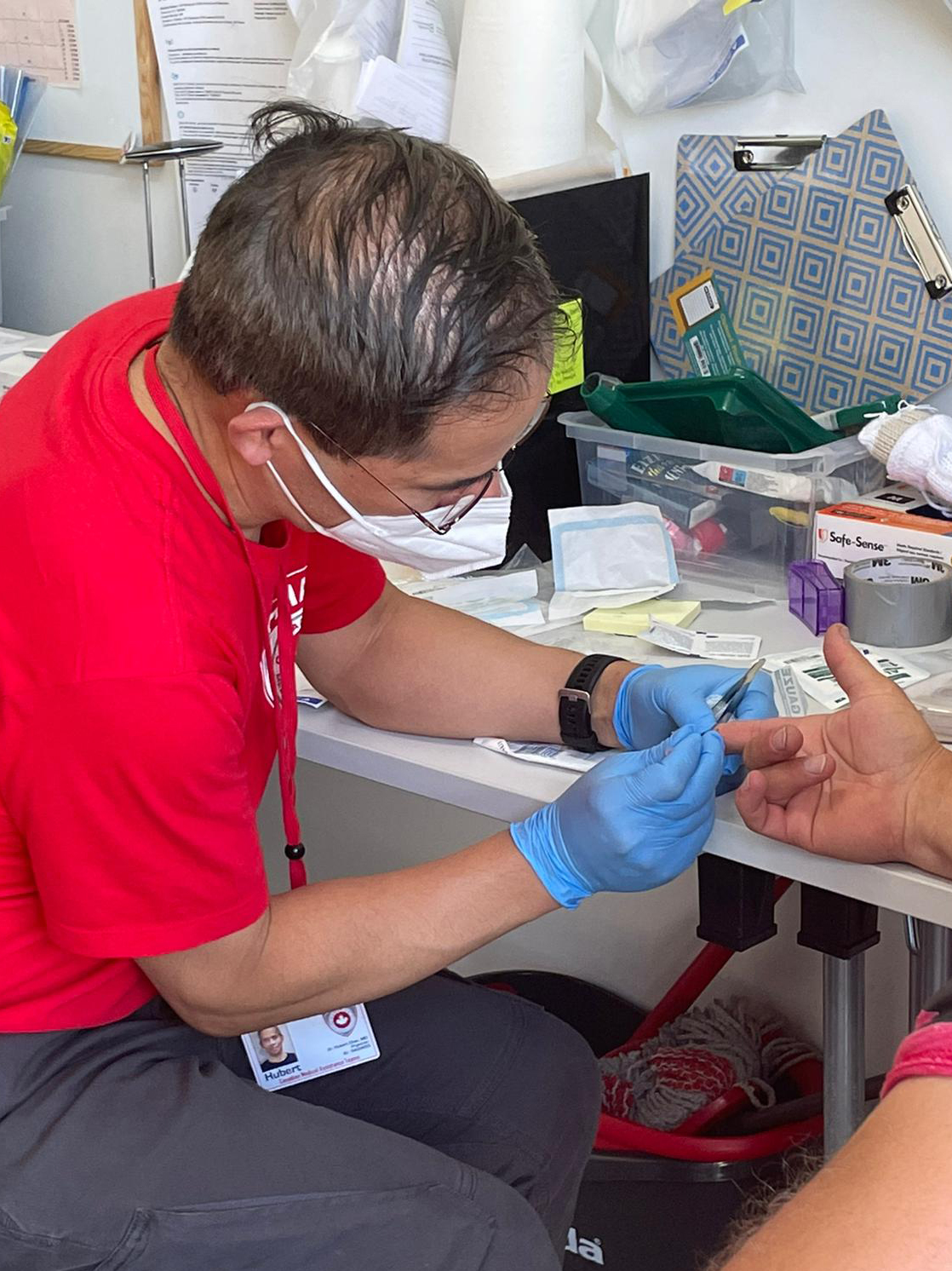 Dr. Hubert Chao treats a patient in May 2022 while on a CMAT mission to provide medical care in Ukraine.