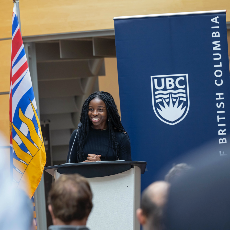 Coralie Tcheune, a UBC undergraduate student in biomedical engineering giving a speech at the podium.
